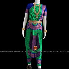 Design by Classical Dance Jewelry® ❥ Traditional Bharatanatyam costume wore during regular dance programs or arrangetram performance. ❥ Material : Art Silk ❥ Type : Traditional pant costume ❥ Easy to wear ❥ layer front fan ❥❥❥❥ 34 inch PANT LENGTH Dress Measurements ( all the measurements approximately 1 -2 margin buffer) ❥ PANT MEASUREMENTS: ☛ Pant Length: 33-34 inch ☛ Pant Waist: 30-31 inch ☛ Pant Hip: 32-33 ❥ BLOUSE MEASUREMENTS: ☛ Blouse length: 12-13 inch ☛ Blouse Shoulder : 13-14 inch ☛ Blouse around Bust: 28-29 inch ☛ Blouse Lower Chest: 26-28 inch ☛ Blouse Sleeves length: 6-8 inch ☛ Blouse sleeve round: 9 - 10 inch ☛ Blouse armpit round: 13 - 14 inch ☛ Dhavani measurements: 46 inch ❥❥❥ Set includes ☛ Pant, Blouse, Dhavani, fans, seat bit etc 🔺🔺🔺 Set includes ☛ Pant, Blouse, Dhav Traditional Green Churidar For Navratri, Green Ceremonial Churidar For Festivals, Green Ceremonial Sets For Festivals, Green Tilla Sets For Traditional Ceremonies, Green Temple Jewelry Sets For Festive Occasions, Festive Green Temple Jewelry Sets, Traditional Green Churidar With Drape, Green Churidar For Traditional Ceremonies And Festivals, Green Churidar With Pallu For Traditional Ceremonies