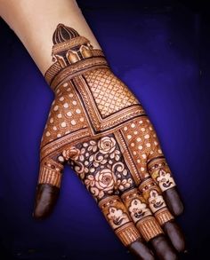 the hand is decorated with intricate designs