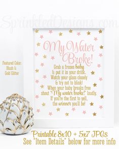 a gold and white wedding sign next to a vase