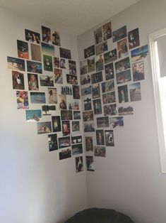 a room with pictures on the wall and a dog bed in front of it's headboard