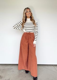 Sophisticated yet comfortable, the Sierra Sunset Pants make a perfect outfit for any occasion. Featuring adjustable drawstrings, pocket details, and a chic pleated design, these pants provide an elevated, statement look with a pop of color. With their high-waisted fit, soft fabric, and stylish wide-leg design, you can easily go from the office to dinner or drinks in style. 92% Polyester 8% Nylon Hand wash cold.