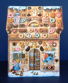 a gingerbread house with buttons on the front