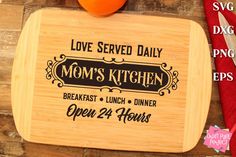 a cutting board with the words love served daily on it and an orange next to it