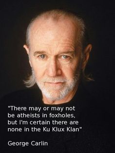 an older man with white hair and beards is looking at the camera while wearing a black t - shirt