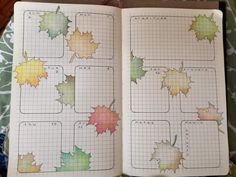 an open planner with leaves on it and the numbers in each section are marked out