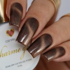 C22 Stellar - A dark beige brown with subtle iridescent sparkles that reminds us of the space between stars. Fall in love with this cozy and unique cat eye color this autumn! The Galaxy Cat Eye Charme Gel colors have great coverages to be worn on its own without a base color. Use it with a magnetic wand to create your own unique cat eye designs or without for a smooth glittery look. PS. Try using 2-3 different colors from this collection to create a colorful galaxy sky! Charme Gel Polish is a 3- Carmel Colored Nails, Brown New Years Nails, Tiger Eye Acrylic Nails, Cats Eyes Nails Designs, Dark Brown Cat Eye Nails, Brown Nails Cat Eye, Gel Nails Fall Colors, Fall Leopard Nail Designs, Brown Cat Eye Nails Design