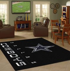 a living room filled with furniture and a large rug that says cowboys on the floor