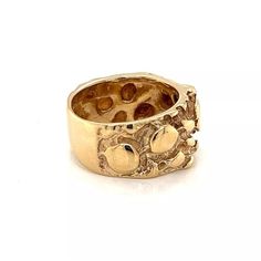 This is a vintage wide band ring, it is crafted from 14k yellow gold featuring and front half with the nugget style. The back of the band is in polished finish.     Material:  14k yellow gold  Measurement: 0.43" wide x 0.15" high  Ring Size:  6.5  Weight: 11.2 grams The Nugget, Wide Band Ring, Wide Band Rings, Yellow Gold Ring, The Band, Wide Bands, Yellow Gold Rings, Band Ring, Gold Ring