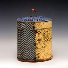 an ornately decorated box with wooden handles