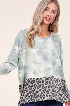 Cloud tie dye and cheetah mix in a slouchy drop-shoulder pullover made in a tunic length with a loose fit. Material: 80% polyester 17% rayon 3% spandex Stretch: Highly stretchy Care: Machine wash cold, gentle cycle, tumble dry low. Made in USA Product Measurements 1X: 44.0-46.0 (Bust) 2X: 46.0-48.0 (Bust) 3X: 48.0-50.0 (Bust) Boxy Top, Tunic Length, Mixing Prints, Chic Boutique, Print Pattern, Cheetah Print, Drop Shoulder, French Terry, High Low