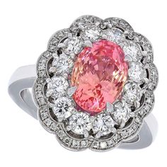 18kt White Gold Diamond Ring 4.06ct Sapphire No Heat Padparadscha SSEF Certified. Unique luxurious ring with natural unheated pink Padparadscha sapphire and diamonds Completely handcrafted Sapphire: pink oval modified brilliant Padparadscha sapphire 4.06 carat in total, light orangy pink, no indications of heating, origin Ceylon. Measurements: 10.18 x 7.27 x 6.4 mm. Diamonds: Brilliant cut diamonds, together 1.38 carat. Material: 18 kt white gold Size: 55 (size adjusted for free) Weight: 13.6 gr Bling Engagement Ring, Month Gemstones, Expensive Jewelry Luxury, Padparadscha Sapphire, Rose Orange, Tourmaline Jewelry, Gold Diamond Ring, White Gold Diamond Rings, Diamond Star