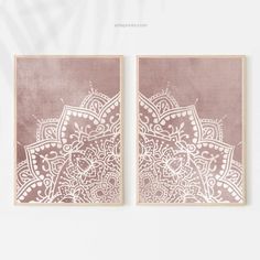 two pink and white wall art pieces with intricate designs on the sides, one in gold foil