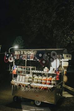 a food cart with lots of items on it