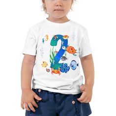 Under the Sea Unisex 1st birthday Shirt by Whirlibird. Let your toddler do their thing while feeling super comfy and looking extra stylish. The tee is soft, durable, and bound to become the staple of your toddler's wardrobe. * 100% cotton * Pre-shrunk fabric Fishing Themed Birthday Party, 3rd Birthday Shirt, 2nd Birthday Boys, 2nd Birthday Shirt, 1st Birthday Shirts, First Birthday Party Themes, Under The Sea Theme, Sea Birthday, Fishing Theme