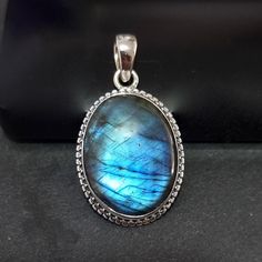 💖  Product Description Stunning Large Boho Oval Blue Labradorite Pendant set in 925 Sterling Silver, with Silver Rope Detailing around the stone..  The pendant pictured is the actual piece you will receive We recommend our 1.5mm Spiga chains for this pendant, which you can select at checkout in various lengths, or just have the pendant on its own.  (Prices with a chain includes the pendant and chain price) If you prefer a different style of chain, we have other chain designs in the Chains Secti Oval Cabochon Labradorite Jewelry, Oval Labradorite Cabochon Jewelry, Silver Labradorite Oval Jewelry, Oval Silver Labradorite Jewelry, Sapphire Cabochon Oval Jewelry, Oval Labradorite Jewelry Stamped 925, Oval Sapphire Cabochon Jewelry, Sapphire Jewelry With Oval Cabochon, Silver Labradorite Jewelry For Wedding