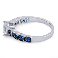 Top of ring height: 5.7mm

Top of ring width: 6mm

Band width: 3.2mm

Shank width: 1.9mm


Stone material: blue & clear cubic zirconia

Center stone size: 6mm

Stone shape: round

Center stone carat weight: .84 ct.

Total number of CZ stones: 33

Stone setting: prong setting


Metal: 925 sterling silver

Plating: rhodium plated

Finish: high polish Stone Material, Stone Setting, Cz Ring, Cz Stone, Stone Settings, Sterling Ring, Rhodium Plated, Prong Setting, Beautiful Rings