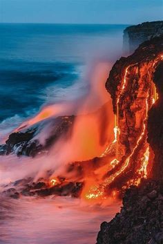 lava flowing into the ocean with lights on it