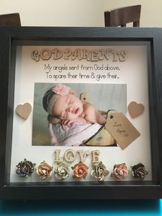 there is a framed photo with the words godparies and two hearts on it