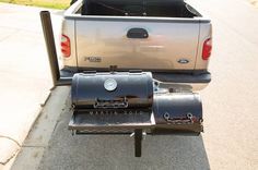 the back end of a pickup truck with an open grill