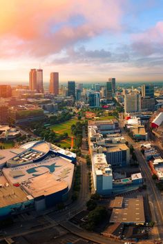 an aerial view of a city with tall buildings