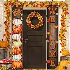 a welcome sign with pumpkins and gourds