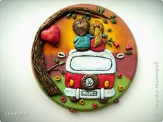 a ceramic plate with an image of two people on top of a camper van