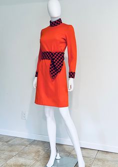 "Fabulous, vintage, totally C1960s orange and navy blue long sleeve dress, featuring a high neck with a dual hook and eye back closure, the original belt, and a back zipper.  Designer label removed. Approximate Measurements:      Chest: 35\"; Waist: 30 1/2\"; Hips: 36\"; Length: 37\"      Belt: 49 1/4\"      No size label - likely a size S/M No fabric label - feels like polyester Condition: Totally 1960s dress is in very good vintage condition; mark/imperfection to back as shown in last photograph (mark should come out with wash/cleaning); marks to one side only of belt, not visible when worn on reverse; hem previously lengthened, could easily be re hemmed to short / mini dress." Fabric Labels, 1960's Dress, Mock Turtleneck, Short Mini Dress, Mod Dress, 60s Fashion, Teen Fashion, Fashion Models, Navy Blue