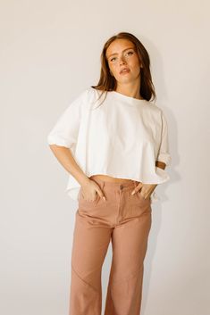 not all oversized white tees are created equal, + this boxy baddie is proof. it has a relaxed, ‘lived-in’ look + features a cropped raw hemline + slouchy, cuffed sleeves. whether you style it with jeans + sneakers to run errands, or throw it on with sweats to lounge around at home, it’s a wardrobe must-have for every hunny. white // scoop neckline, cropped, high low hem, raw hem, batwing sleeve, cuff detailing model is 5'6" + wearing a small measurements are approximate + taken while laying flat small : bust 76” length 19.5” medium : bust 78” length 20” large : bust 80" length 20" more fit + fabric info : cotton // fabric has no stretch // fits oversized Sleeve Cuff, Cropped Tee, Large Bust, High Low Hem, Batwing Sleeve, Small Bust, Crop Tee, Cuff Sleeves, Scoop Neckline