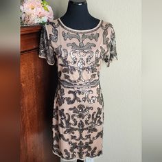 Beautiful, New With Tags, Damask Print, Full Sequin Dress. It Has A Sexy Mess Section At The Waist To Show A Tiny Bit Of Skin. Great Wedding, Date Night Sexy Dress. Zip Up Back. Has Some Stretch Measurements (Flat Lay) Bust: 19 In. Hips: 18 In. Length: 36 In. Brand: Minuet Size: Large Color: Brown, Tan, Black Material: 100% Polyester Full Sequin Dress, Damask Print, Wedding Date, Petite Dresses, Black Tan, Black And Tan, Flat Lay, Sequin Dress, Damask