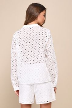 When it comes to relaxation, a cool drink, a sea breeze, and the Lulus Caribbean Chic Ivory Cotton Eyelet Embroidered Long Sleeve Top are a perfect combo! Eyelet-embroidered cotton shapes this breezy top that has long sleeves with button cuffs and an understated collared neckline. Pair with the matching shorts for a complete look! Fit: This garment fits true to size. Length: Size medium measures 22" from shoulder to hem. Bust: Great for any cup size. Waist: Not Fitted - comfortable room througho Spring Floral Embroidered Tops For Loungewear, Spring Loungewear Tops With Floral Embroidery, Floral Embroidered Tops For Spring Loungewear, Spring Embroidered Tops For Loungewear, Embroidered Tops For Spring Loungewear, Spring Beach Top With Chikankari Embroidery, Summer Floral Embroidered Long Sleeve Top, Vacation Long Sleeve Top With Chikankari Embroidery, White Long Sleeve Blouse For Loungewear