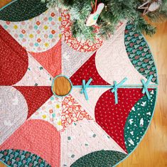 a quilted christmas tree skirt on the floor