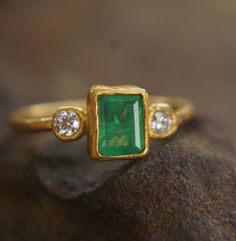 24k gold emerald ring//green emerald and moissanite//24k emerald gold//unique emerald engagement ring//artisan emerald ring//handmade ring A new collection was born today. Rings collection , all of them are light, thick and gentle. Stone is beautiful  green emerald 6.5x4.3 mm. moissanite are 2mm (2 stones) I used 24k gold for the setting and 22k for the rest of the wire ring - 1.4 mm The jewelry will be packed in a gift box and is ready to give as a gift. Your jewelry will be shipped via registered air mail with tracking number. Gold Emerald Ring, Emerald Ring Gold, Rings Collection, Wire Ring, Emerald Engagement, Wire Rings, Emerald Engagement Ring, Green Emerald, Ring Collections