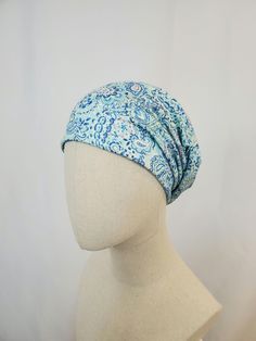 Slouchy chemo hat in blue paisley print. Shades of blue with a little of pink and yellow. Please note this hat style has a different cut. Two layers of thin T shirt type jersey knit. Material is rayon lycra knit. The weight of this chemo hat is light weight. Casual style, can be styled in several ways to suit your needs. The print is very large and pattern placement will vary on each hat.  One size fits most. Gentle wash and cool dryer. Made in USA. Hat Light, Chemo Hat, Hat Style, Slouchy Hat, Blue Paisley, Pink And Yellow, Paisley Print, Hat Fashion, Types Of Shirts