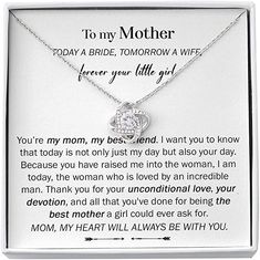 a mother's necklace in a box with the poem to my mother on it