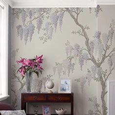 a living room with flowers on the wall