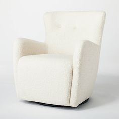 a white chair sitting on top of a wooden base