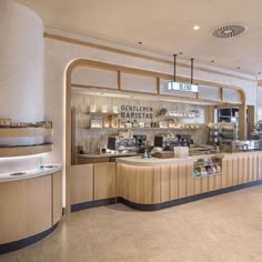 the inside of a restaurant with wooden counter tops