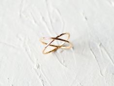 "\"Dainty stylish gold vermeil infinity ring, plain gold criss-cross boho style ring. X shaped ring provides a perfect look with any outfit. Trendy double ellipse ring, simple yet timeless gold minimalist jewelry. Dainty stacking ring, comfortable to wear from morning till night.  Promise ring, Valentine's Day gift for girlfriend, gift for wife, gift for daughter, \"\"just because\"\" gift for her. Ideal bridesmaid gift. Specifications :--- ✔️ Made to Order. ✔️ Band Measures ~ 1 mm ✔️ Band Thickness ~ 1 mm ✔️ Metal Options ~ 14K Gold Vermeil  ✔️ Handmade Jewelry Q: What is 14k gold vermeil? A. Gold vermeil is a type of gold jewelry made to last. The base metal is Sterling Silver which means your piece is made from precious metals only. A thick layer of gold is then electroplated over the b Gold Infinity Ring, Hammered Gold Ring, Gold Minimalist Jewelry, X Ring, Criss Cross Ring, Wedding Band Engraving, Gold Anniversary Rings, Silver Opal Ring, Snake Ring Silver