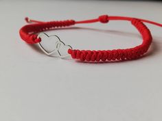 Lovely double hearts red thread bracelet. Easy to wear design. Perfect gift for mom of twins. Charm and beautiful jewelry. Hand knitted kabbalah red bracelet. Lucky red string. Charm double hearts bracelet. This pretty bracelet is made with sterling silver 925 elements and high quality hand knitted red thread Griffin. 100% waterproof. Universal Adjustable size. Ready to ship in 1-3 business days. Visit our shop here https://etsy.me/2Yroo3X Visit our Facebook Page 👇👇 https://www.facebook.com/Ka Red Heart Charm Bracelet For Friendship, Personalized Red Heart Bracelet, Adjustable Red Heart Friendship Bracelets, Red Heart Bracelets For Friendship, Personalized Red Heart Bracelet For Friendship, Adjustable Red Heart Bracelet For Friendship, Valentine's Day Heart Friendship Bracelets With Adjustable Cord, Handmade Heart Bracelet As Best Friend Gift, Valentine's Day Adjustable Cord Heart Bracelet For Friendship