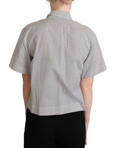 Discover the epitome of Italian elegance with this stunning collared polo top from Dolce & Gabbana. Tailored from the finest 100% cotton, this shirt is a testament to meticulous craftsmanship and timeless design. Featuring a chic polka dot pattern in black and white, this top elevates any ensemble with a touch of sophistication. Its short sleeves make it the perfect choice for a smart yet comfortable daytime look. Proudly made in Italy, this polo exudes the luxurious aura that Dolce & Gabbana is Black White Logo, Italian Elegance, Black Shades, Blazer Suit Women, Mens Leather Accessories, Buy Sweaters, Polo Top, Dolce E Gabbana, Womens Tights