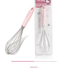 a pink kitchen utensil in a package with its handle and whisk