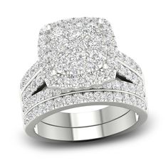 a white gold wedding ring set with two rows of diamonds on the band and one row of