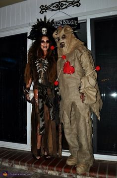 two people dressed in costumes standing next to each other