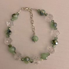 Green and clear glass beaded bracelet. Beaded Green Bracelet, Jewelry Aesthetic Green, Bead Crystal Bracelet, Friendship Bracelets Glass Beads, Cute Green Bracelet, Green Beaded Bracelets Aesthetic, Clear Bracelet Ideas, Green Diy Bracelet, Diy Green Bracelet