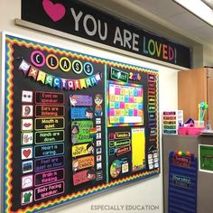 a bulletin board with words and pictures on it in an office cubicle that says you are loved