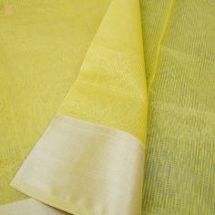 Khinkhwab brings you Maheshwari Sarees. Maheshwari handlooms owe their name to Maharani Ahilyabai Holkar, the ruler of the state of Indore in the late 18th century. Her reign was deemed the Golden Age, and she is revered by all at Maheshwar as Devi Ahilyabai or Ma Saab till date. Maheshwari handlooms derived their fine simplicity from this icon. It is said that under her artistic guidance, the craftspeople made light fabrics, detailed with motifs derived from carvings on the Maheshwar fort- a de Traditional Wear With Tissue Silk Border, Traditional Slub Silk Wear With Border, Yellow Handloom Slub Silk Dupatta, Slub Silk Dupatta With Border, Yellow Tussar Silk Dupatta With Border, Tissue Silk Dupatta With Border For Puja, Yellow Cotton Silk Dupatta For Puja, Traditional Cotton Silk Dupatta With Border, Cotton Silk Dupatta With Border For Traditional Ceremonies