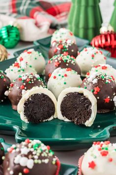 chocolate covered christmas truffles on a green plate