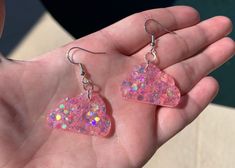 "Each pair of resin earrings are made to order, therefore no two pairs are identical! However, I try to get as close as possible :) Made with nickel free, hypoallergenic fish hooks.  Each cloud is approximately 1.25\" wide and has pink holographic chunky mix glitter ✨ Thanks for visiting my shop! ☁️" Whimsical Pink Resin Earrings, Unique Pink Resin Earrings, Clear Hypoallergenic Resin Earrings, Hypoallergenic Clear Resin Earrings, Handmade Clear Resin Earrings, Whimsical Nickel-free Resin Earrings, Cloud Earrings, Pink Holographic, Pink Cloud