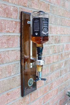 Are you looking for a unique and elegant way to pour your drinks? The Wall dispenser is a beautiful and easy-to-use piece for your wall. Imagine having your favorite drinks on tap and ready to use anytime. This dispenser measures an EXACT SHOT! There are hooks on the back for easy installation. HOW TO USE:Make sure the dispenser is mounted correctly (recommended to be mounted to the wall). Open your bottle of choice and attach it to the dispenser. Once you attach the dispenser flip your bottle and clip it on the wallboard. Once the bottle is clipped, you must push up on the three prongs and your drink will pour. Make sure to watch the video as well!! NOT FOR CARBONATED DRINKS! DIMENSIONS:Height: 20" InchesWidth: 6" Inches Depth: 5" Inches If you are not satisfied with the options listed be Industrial Lights, Liquor Dispenser, Burnt Wood, Mounted Bottle Opener, Wall Mounted Bottle Opener, Carbonated Drinks, Horse Trailer, Home Catalogue, Wall Bar