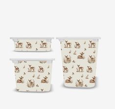 three plastic containers with deers on them, one is white and the other is brown